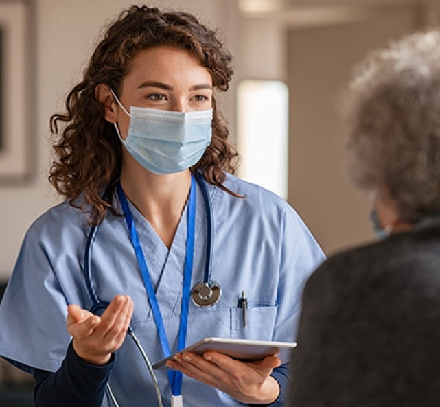 Nurse talking to patient