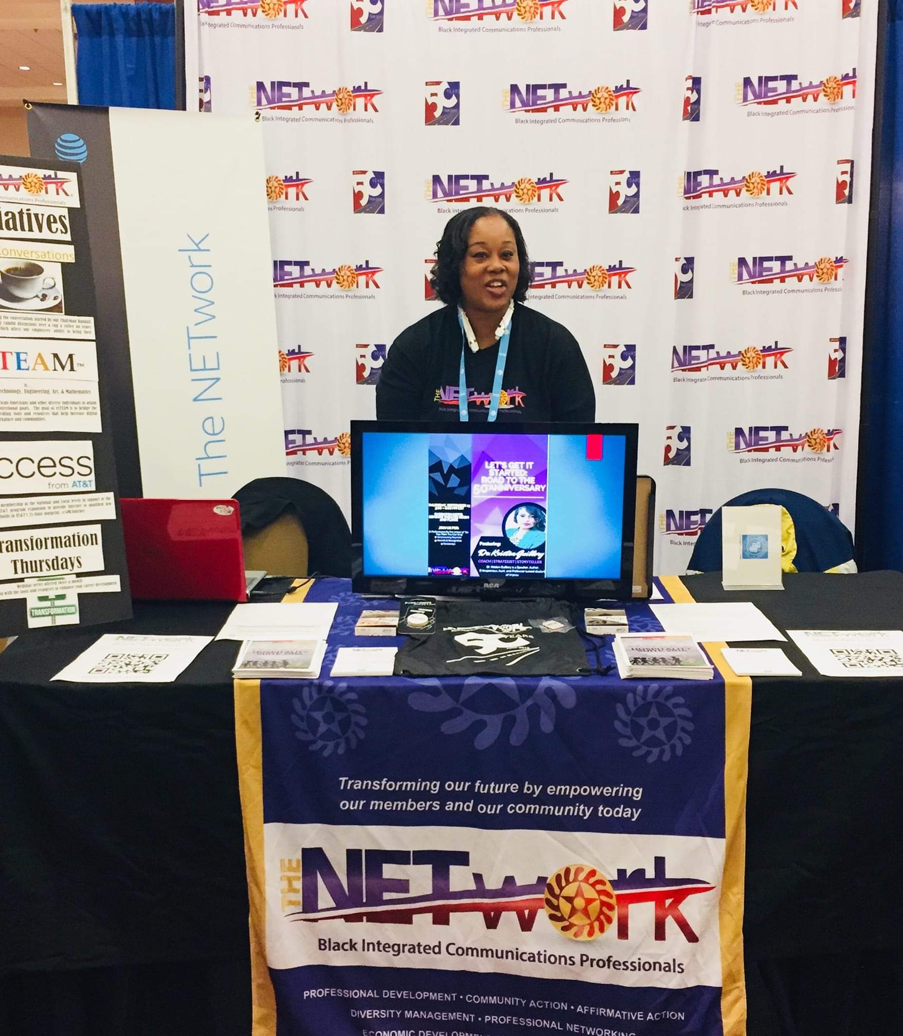 gina sitting at booth