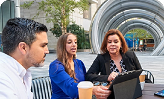 Two people talking outside 