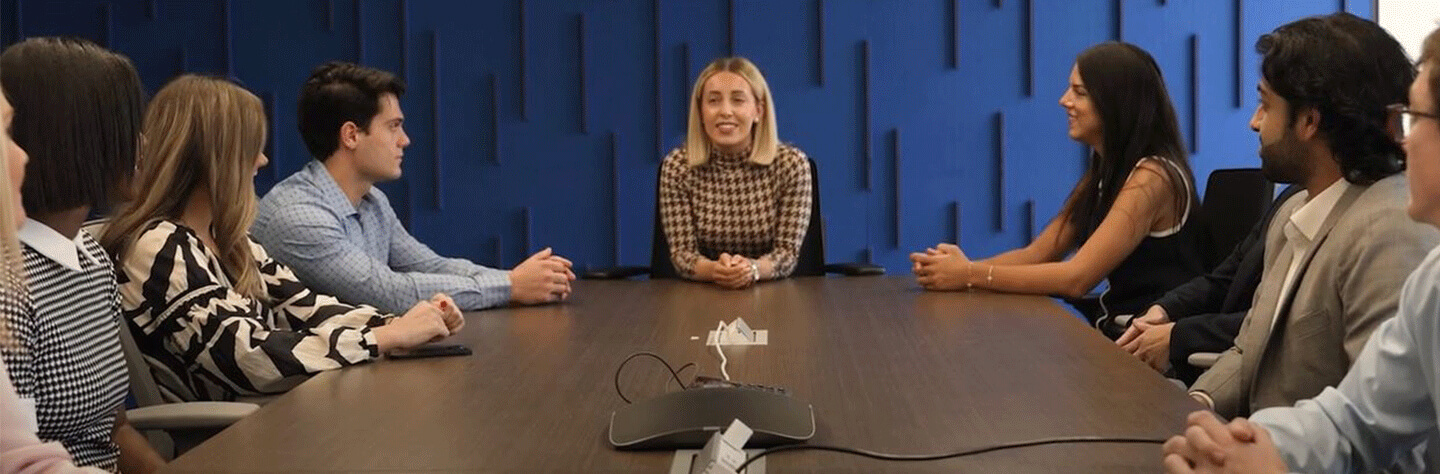 People sitting around at table at work