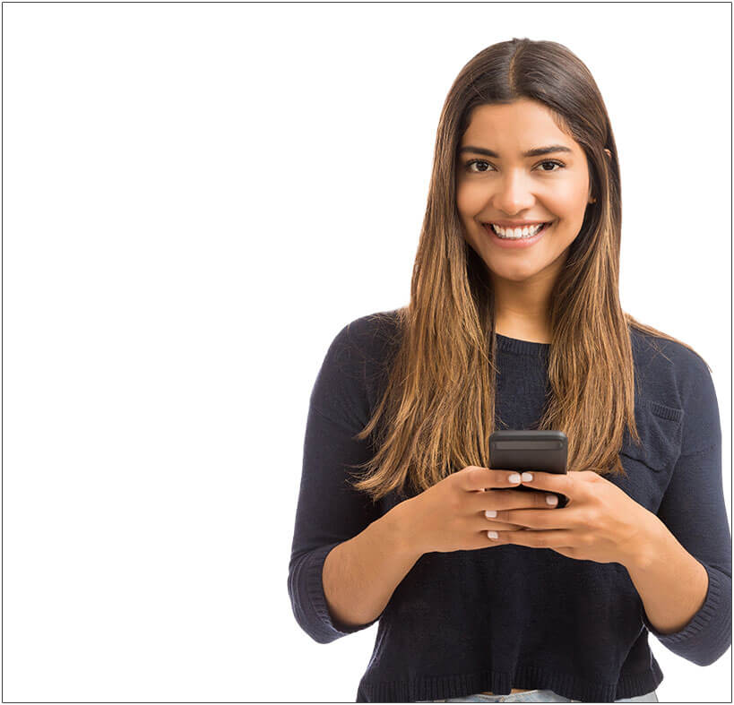 Female employee holding cellphone while smiling