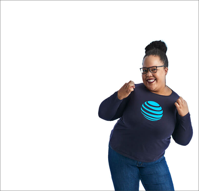 Female employee pulling on collar and smiling