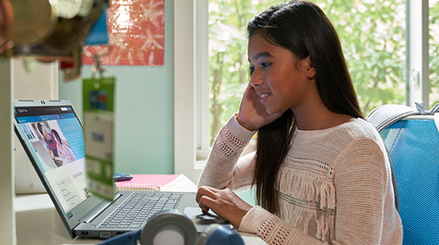 Young girl using a laptop