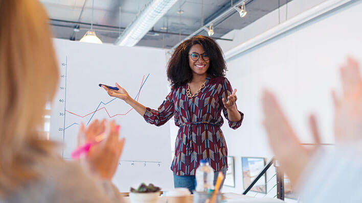 Female employee leading meeting