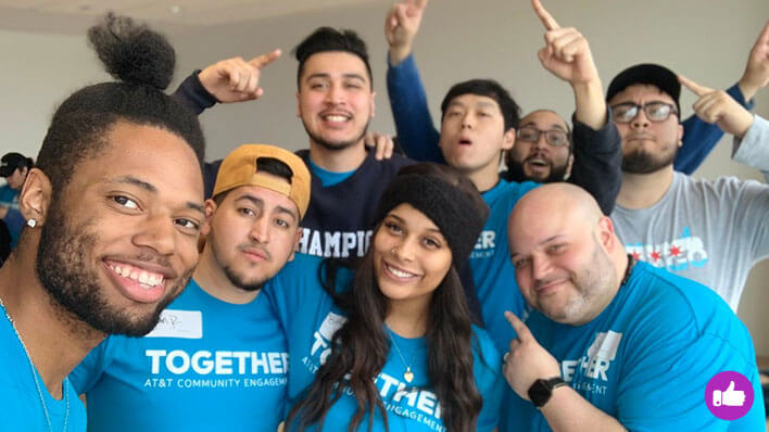 Employees volunteering and smiling for group picture