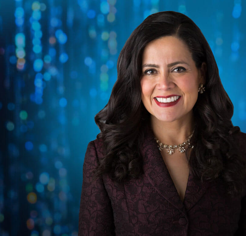 Female Hispanic employee smiling