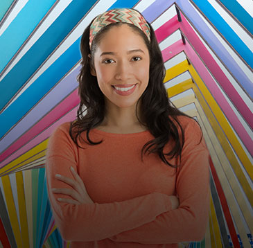 Employee crossing arms and smiling for picture