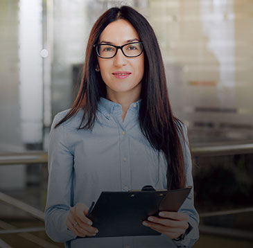 Female employee holding a clipboard