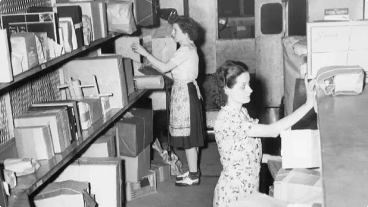 Old picture from 1944 of women sorting packages.