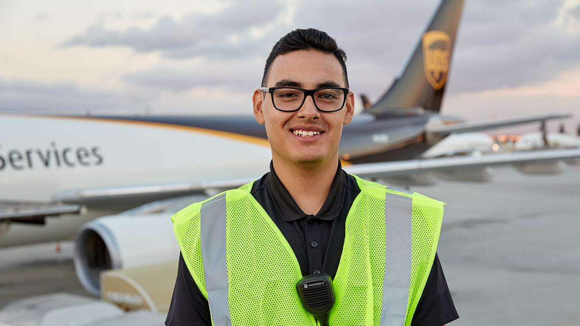 A UPS Aircraft Engineer standing in front of a UPS plane