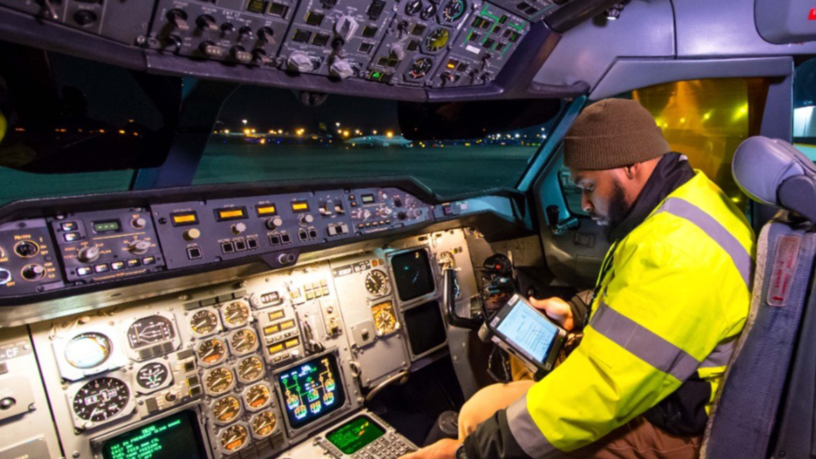 A UPS Aircraft Maintenance Technician inside of an aircraft