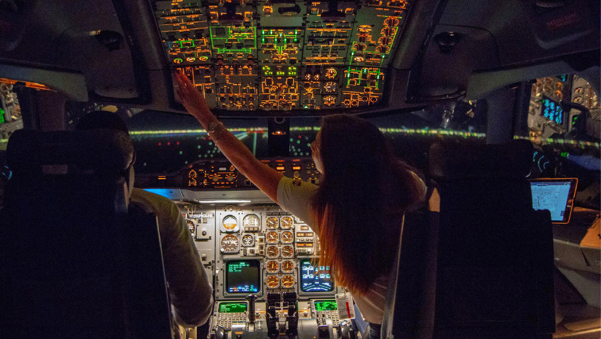 Two UPS pilots inside the cockpit of an aircraft