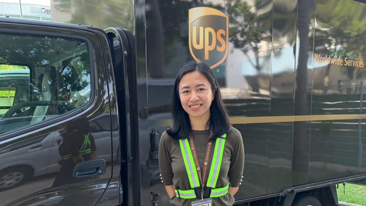 Woman standing in front of a UPS truck