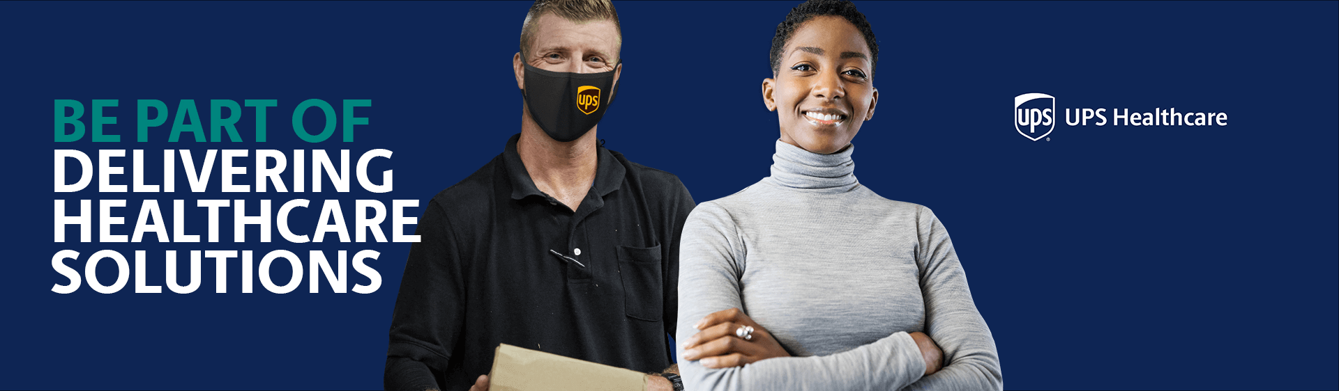 Man smiling while wearing mask and holding a box, next to a woman smiling