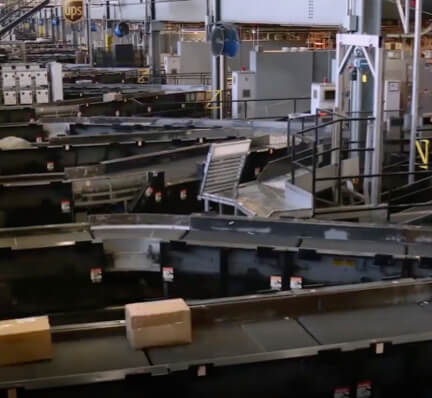 UPS facility with boxes on conveyer belts