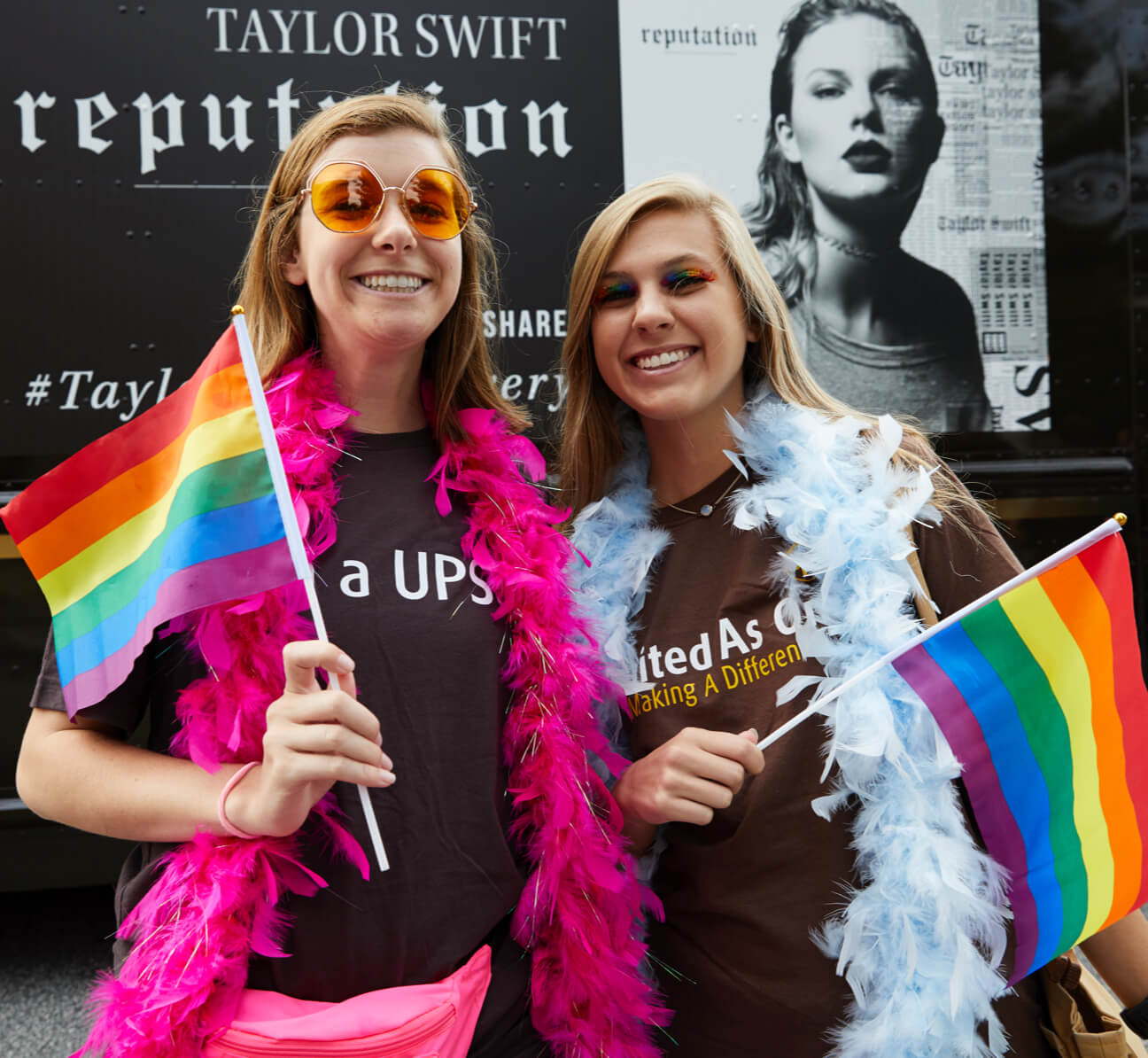 Two women standing with Flag