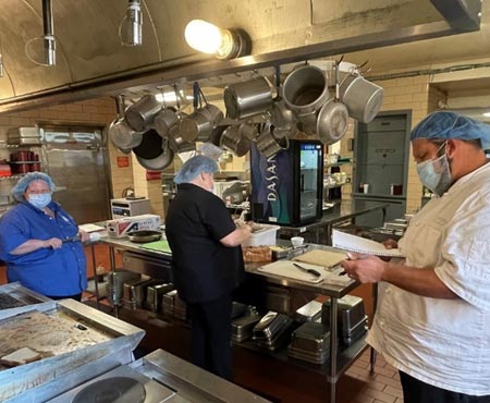 People working in a commercial kitchen