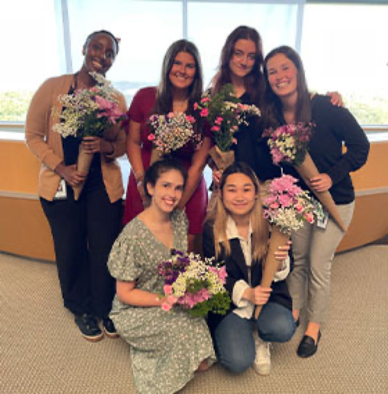 group of people with flower bouquet