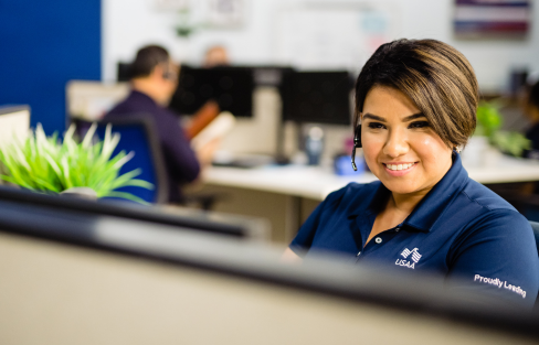 Property and Casualty employee at her desk taking customer calls