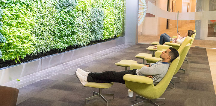 Two people sitting in chairs and relaxing