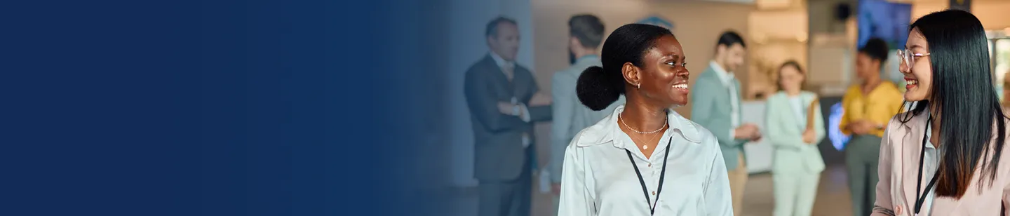 Two people wearing name tags at an event