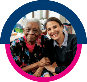 caregiver smiling with her patient