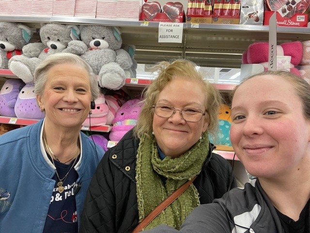 Three women smiling