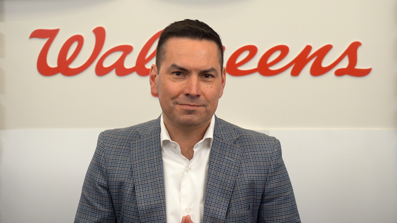Rick Gates in front of a Walgreens logo