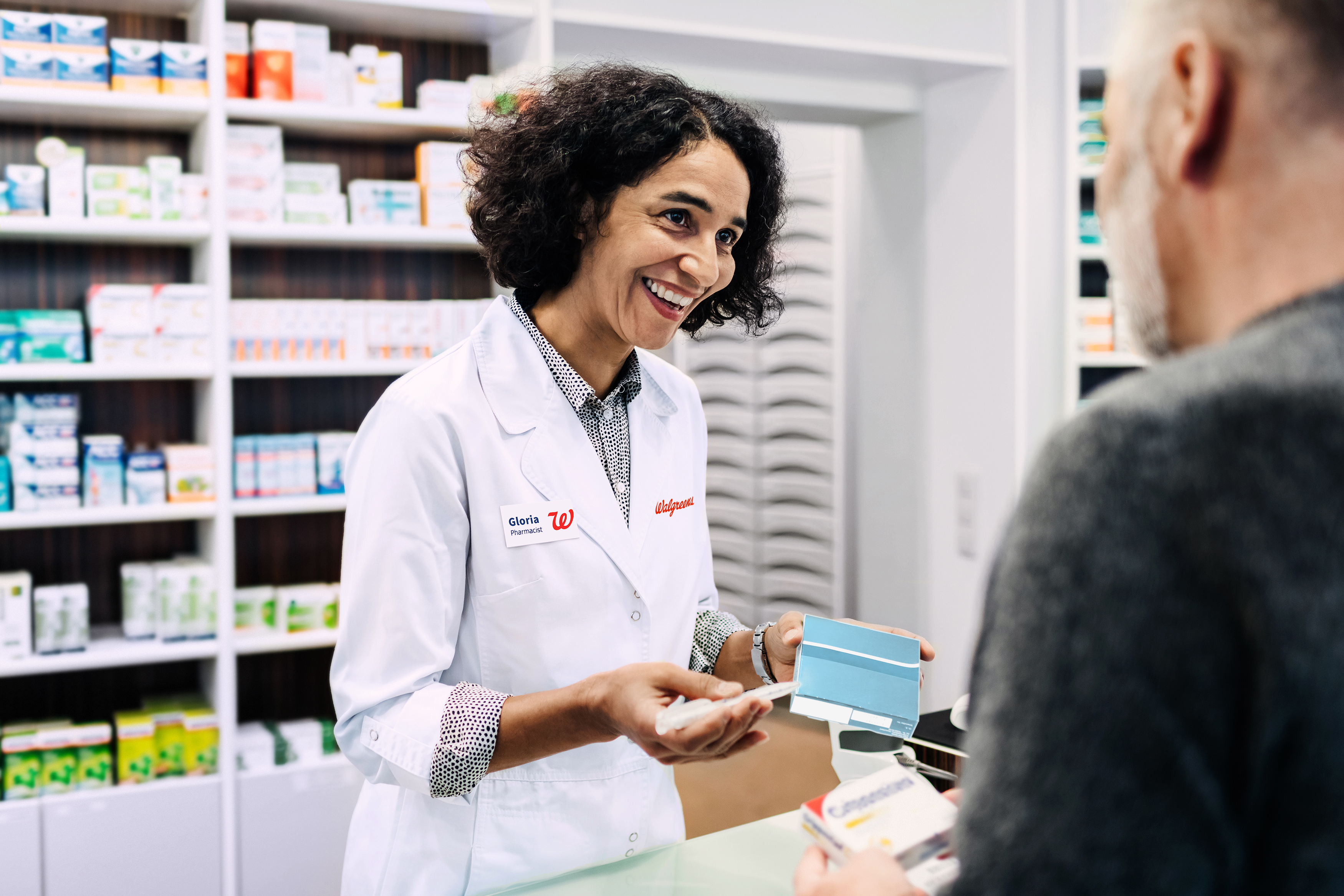 Pharmacist helping customer