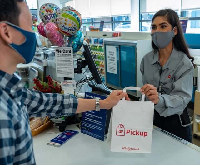 Employee checking out a customer at checkout