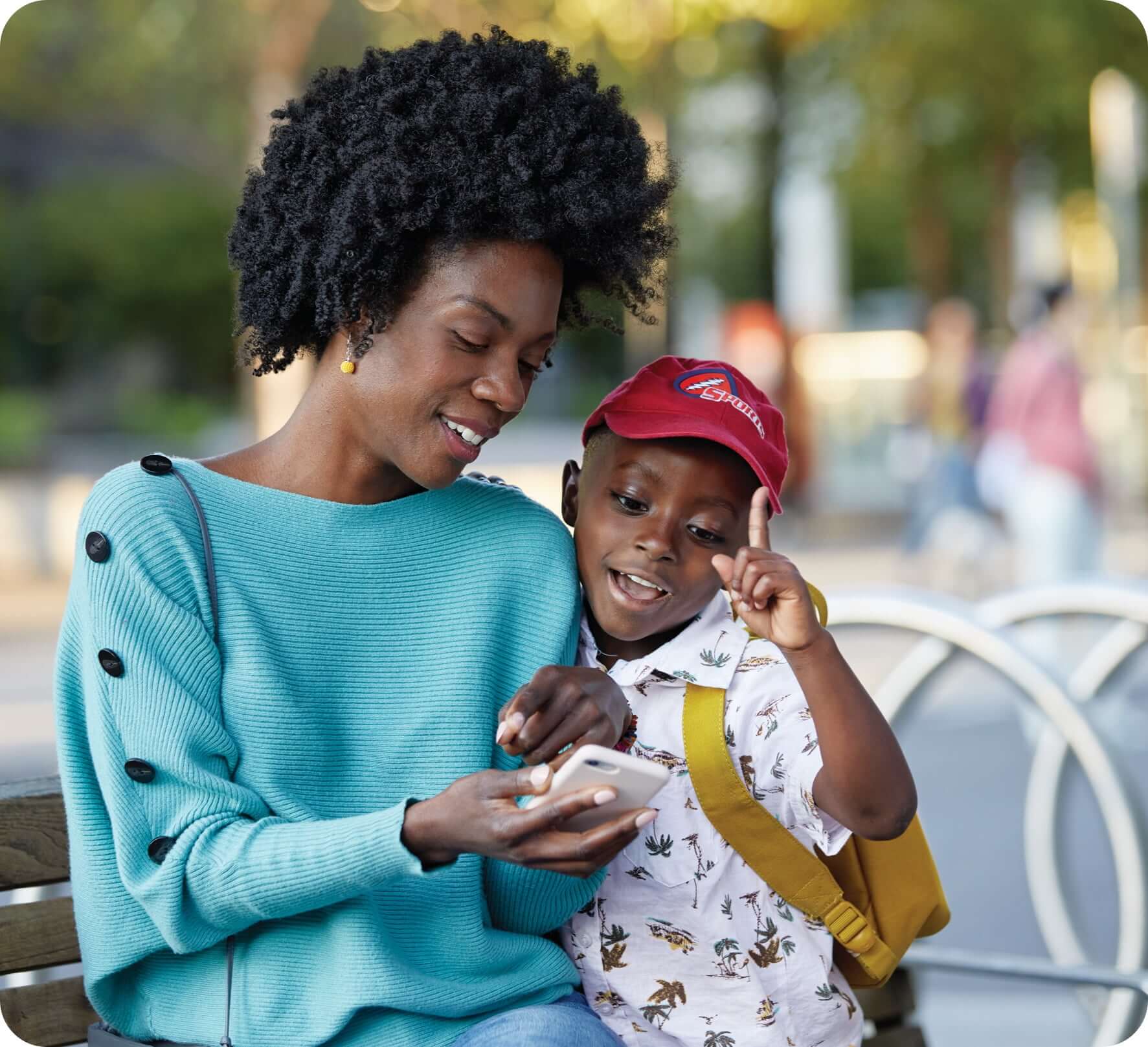 Parent showing their phone to their child