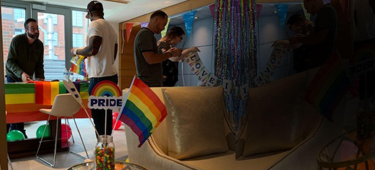 Employees setting up for Pride Month