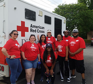 Employees posing for a picture after volunteering for the American Red Cross