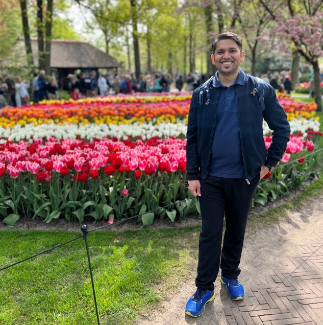 ambarish standing in a garden