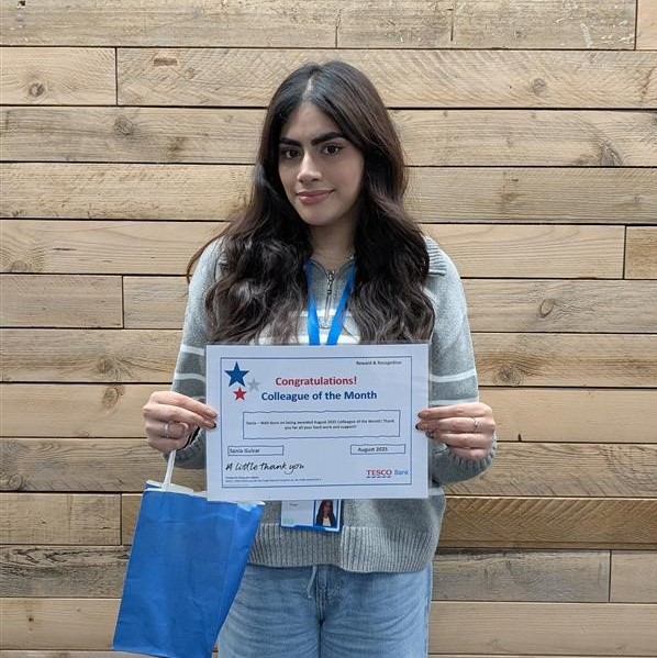 a photo of Sania holding a certificate