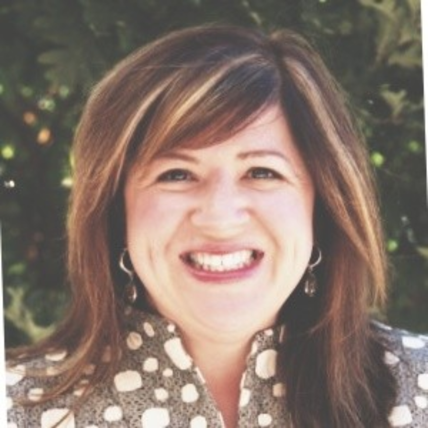 woman with brown hair smiling