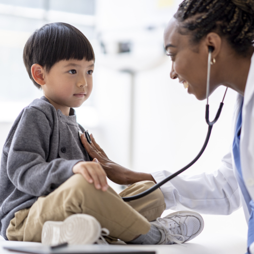 Doctor with younger child patient