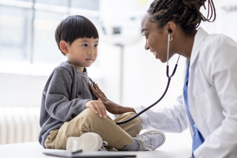Smiling kid on a hospital bed