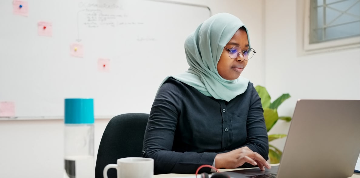 A woman working on a laptop