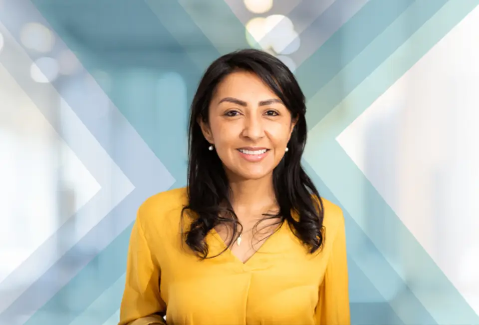 Woman in yellow shirt smiling