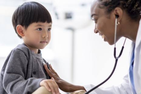 Doctor with younger child patient