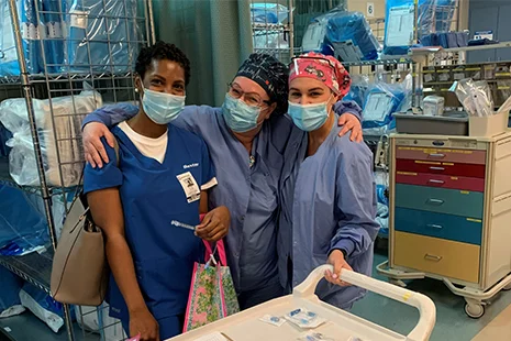 Three doctors with scrubs and surgical mask on