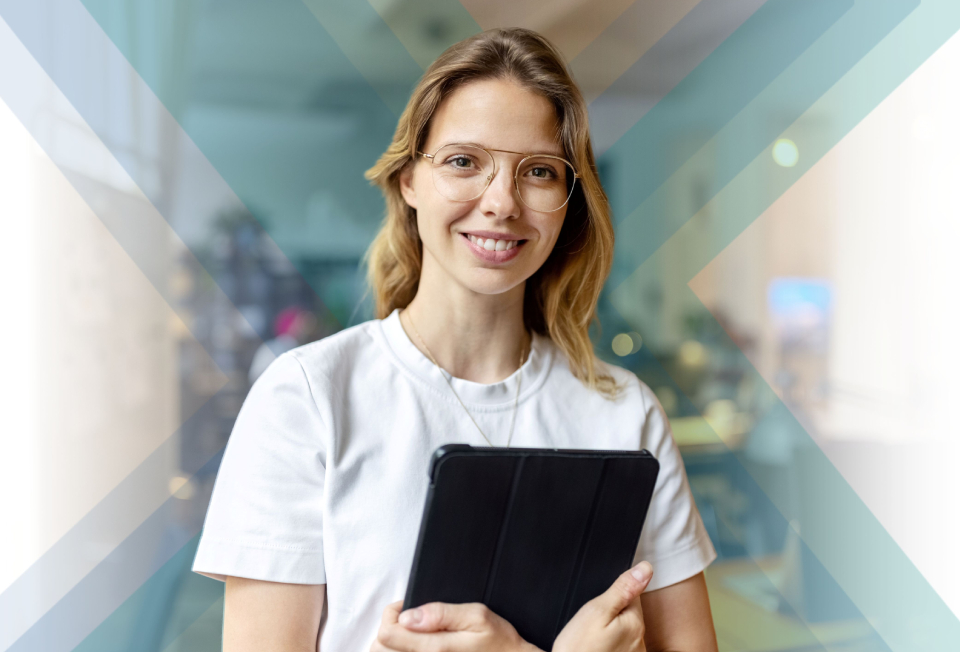 Female wearing white t-shirt and holding tablet 