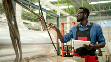 Male employee working with plastic materials