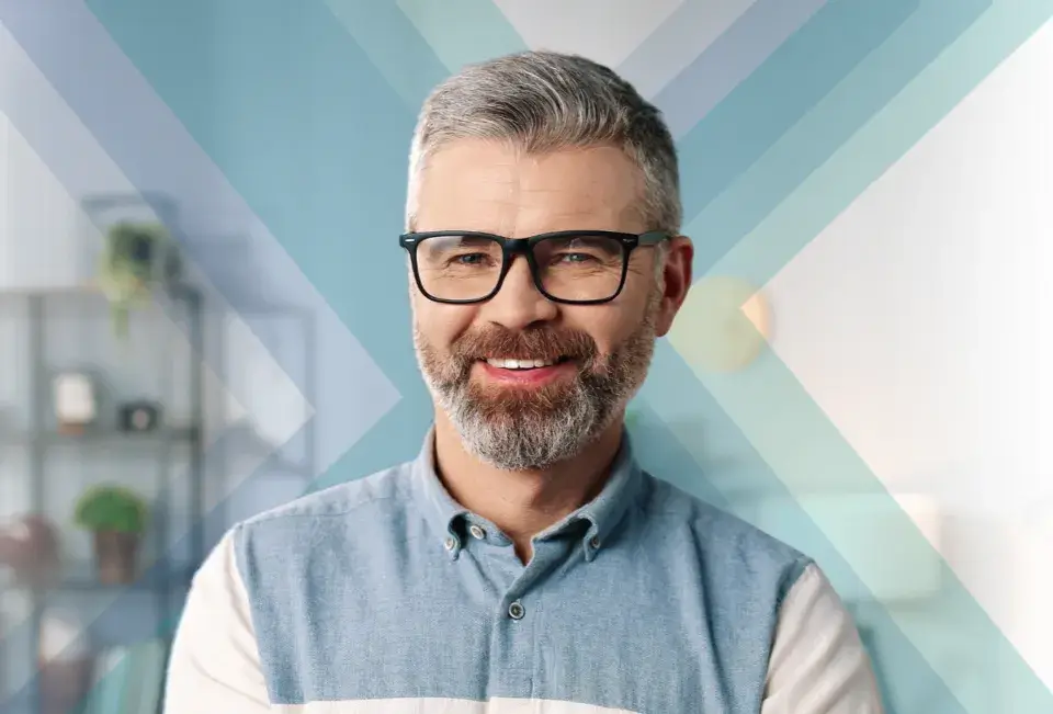 Confident middle-aged man with a beard and glasses