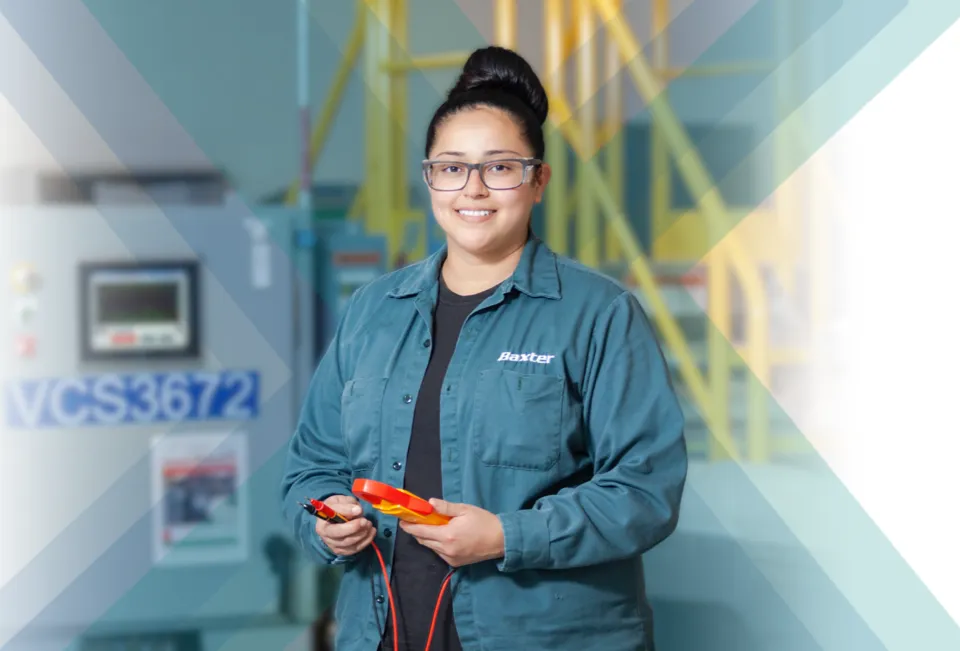 Woman in blue shirt and glasses holding a red tool