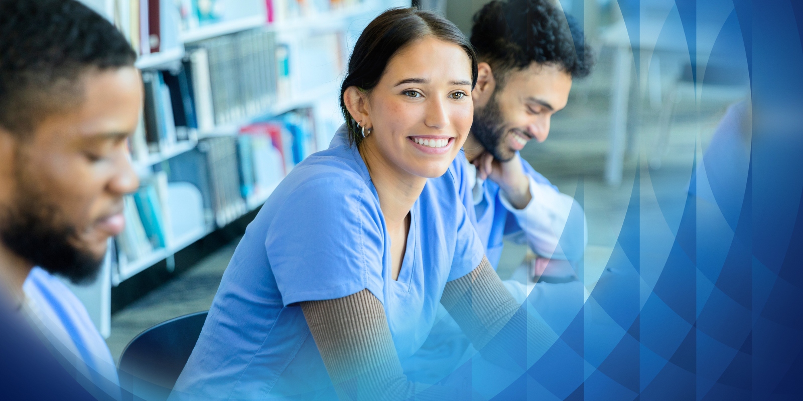Two people wearing safety vests laughing