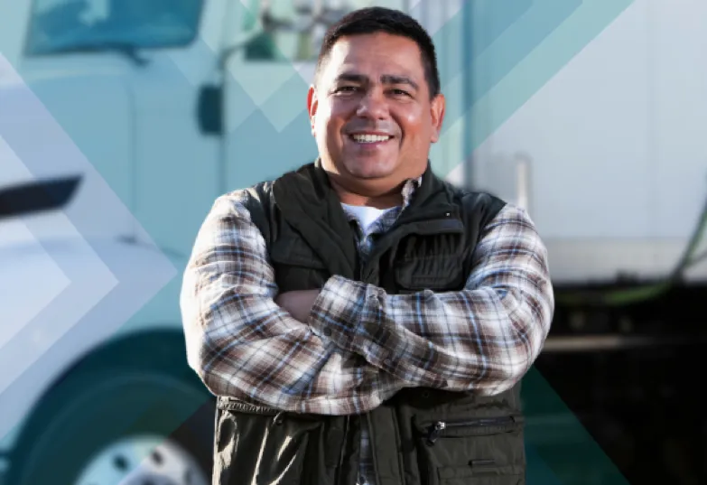 A man standing in front of a semi truck