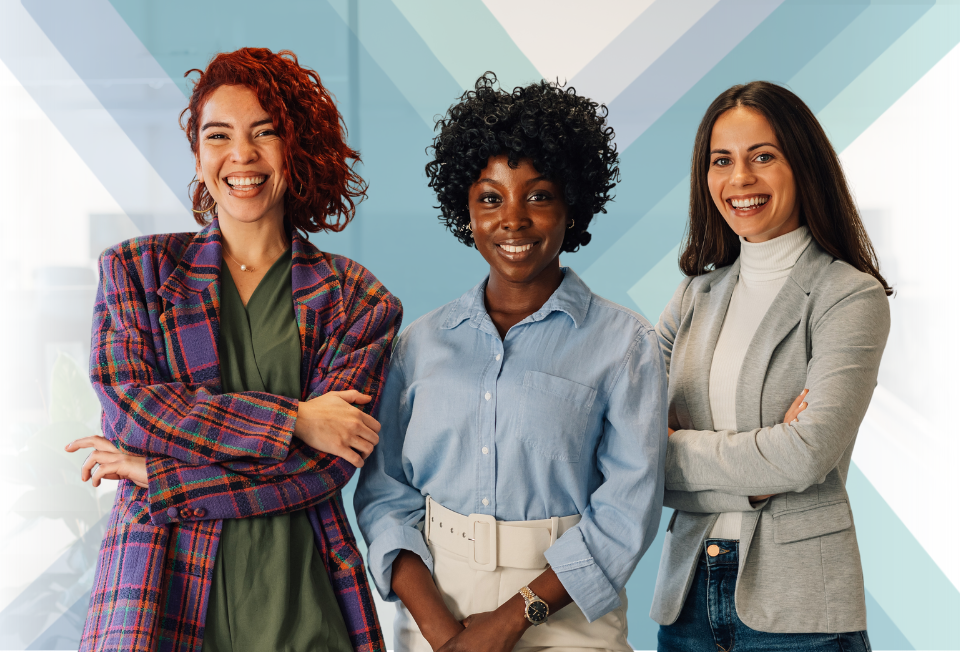 Three women standing smiling