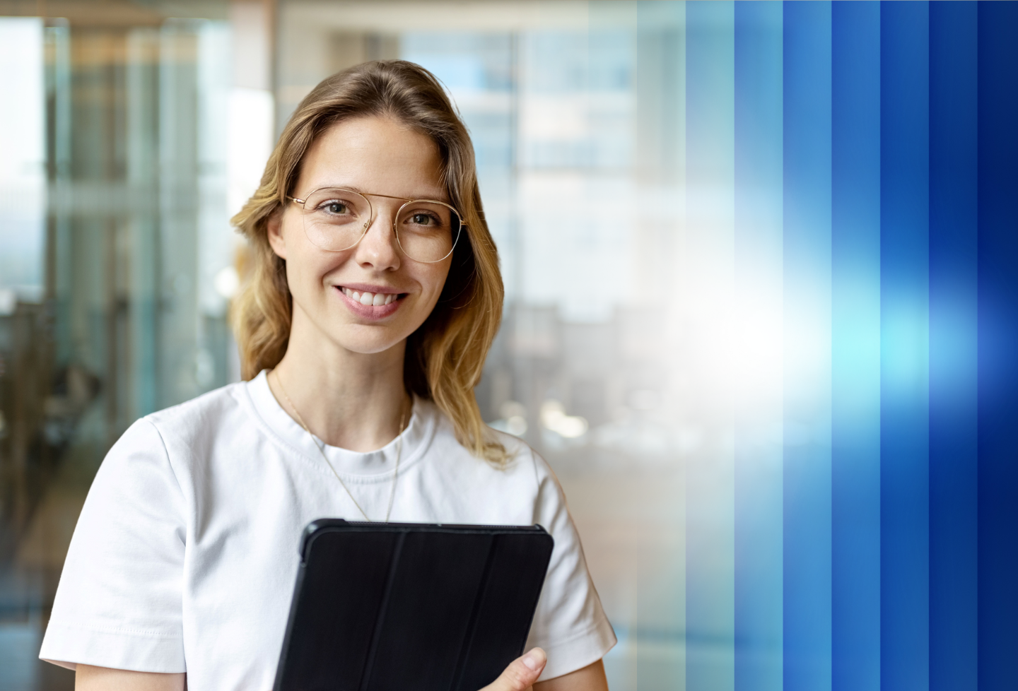 Female wearing white t-shirt and holding tablet